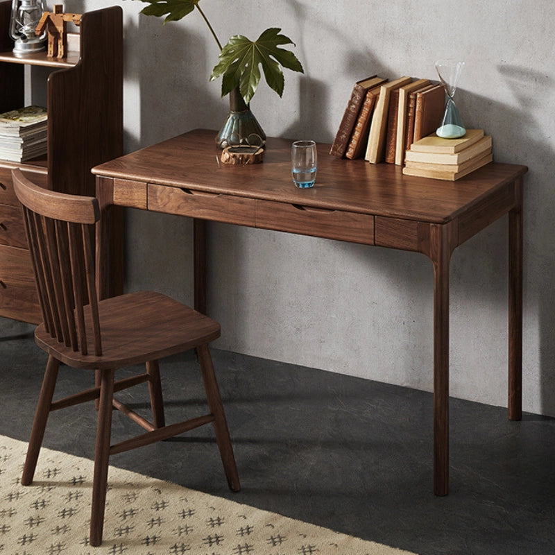 Compact walnut desk in a cozy workspace setting, ideal for writing and creative projects.