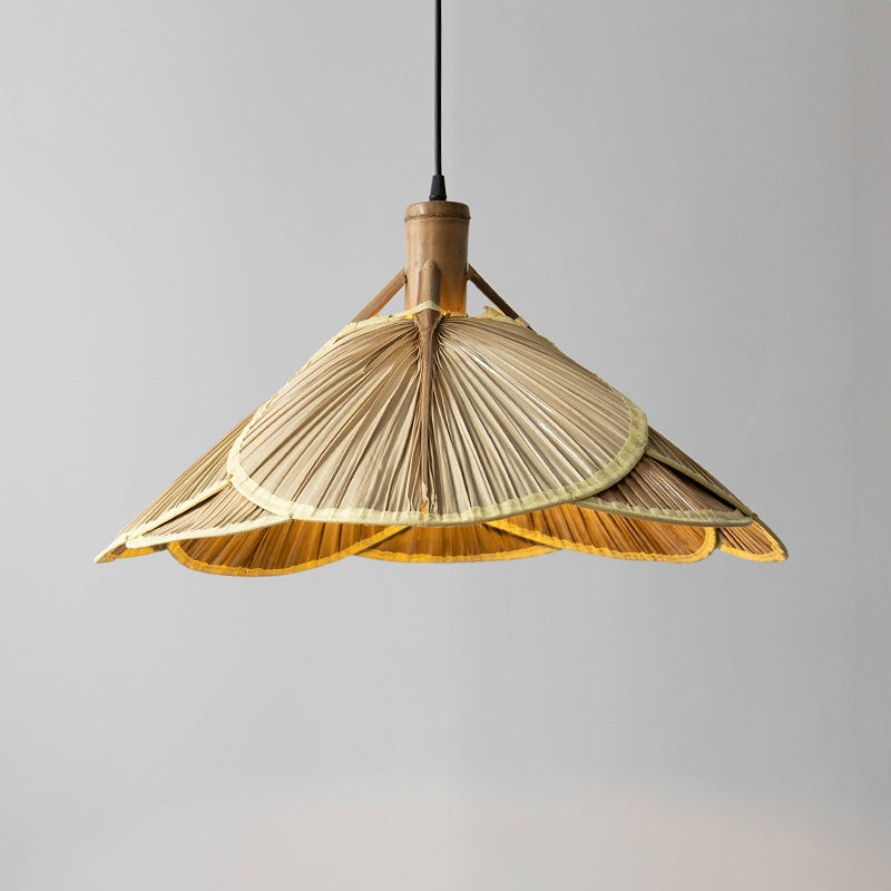 Elegant handmade bamboo pendant light hanging in a cozy living room