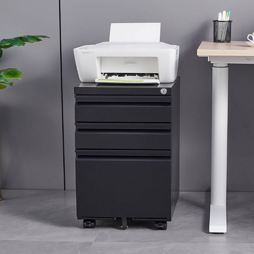 Interior view of the mobile filing cabinets drawers filled with office supplies and documents