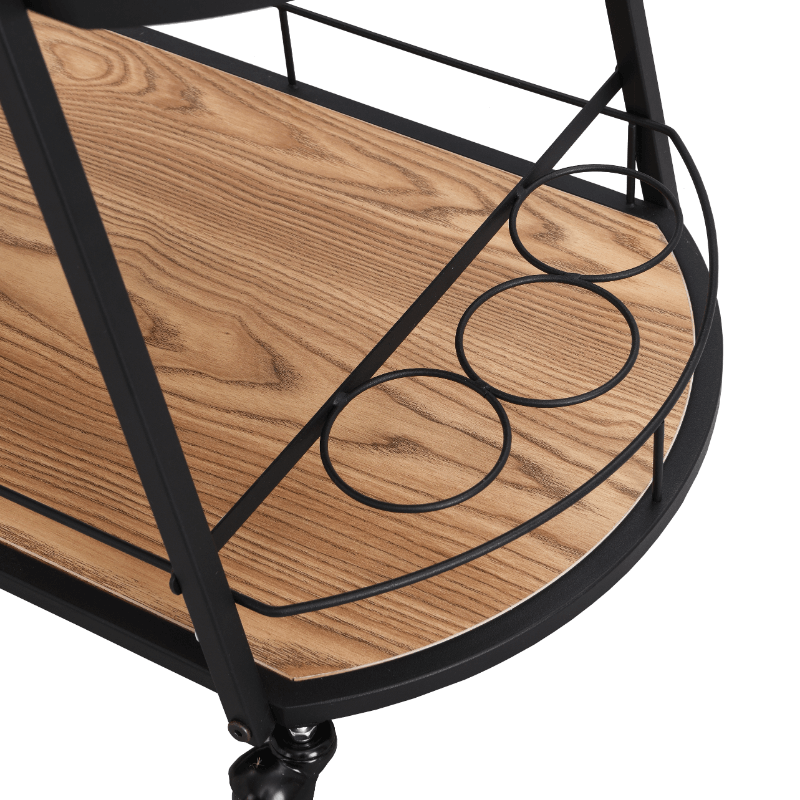 Angled view of modern bar cart with wheels and shelves, fully stocked with wine and glassware