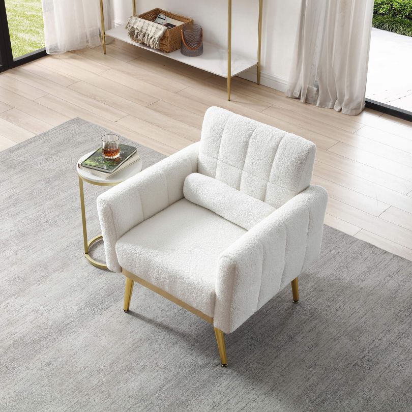 Front view of white teddy fabric armchair showing gold tapered legs and tufted back