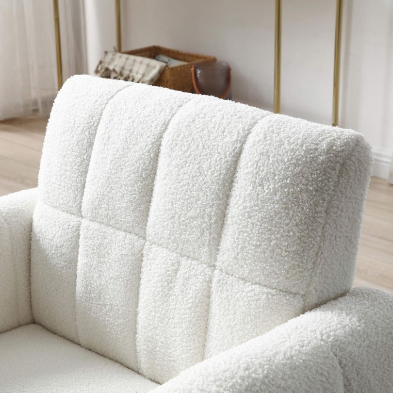 Side angle of affordable mid-century armchair with pillow on light wood floor