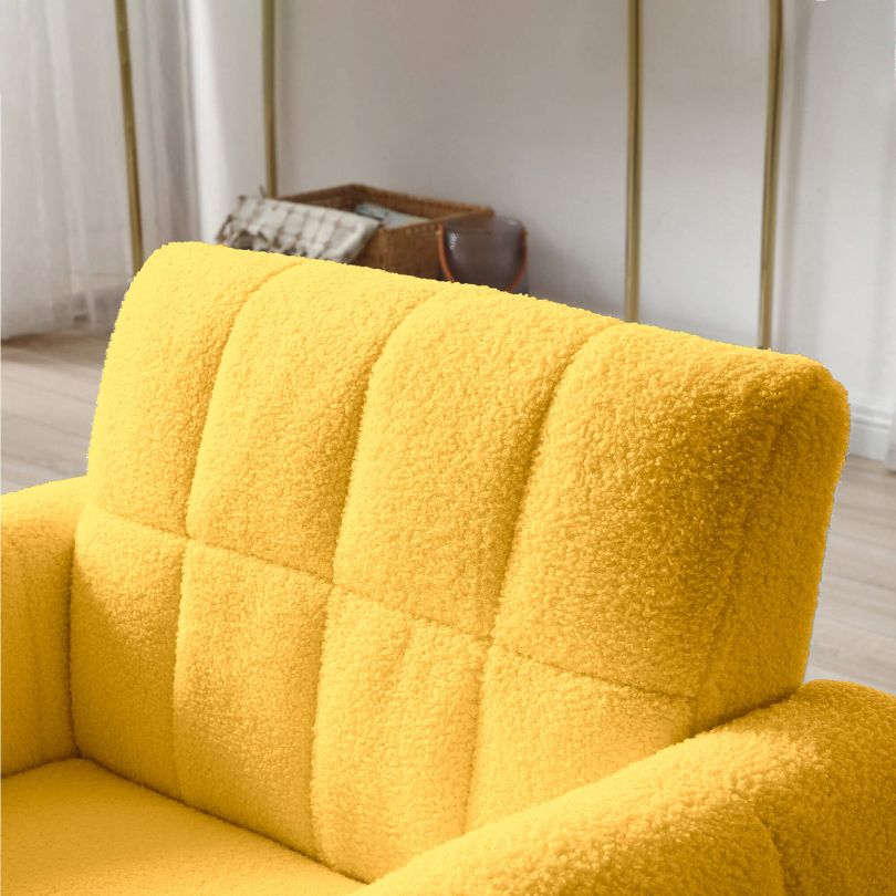Close-up of the waist pillow on the yellow accent chair, emphasizing support and style.