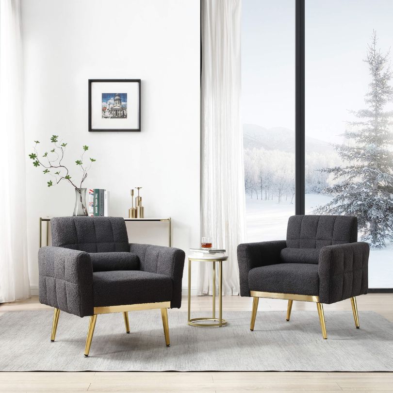 Side angle of the modern armchair showcasing its gold metal legs.