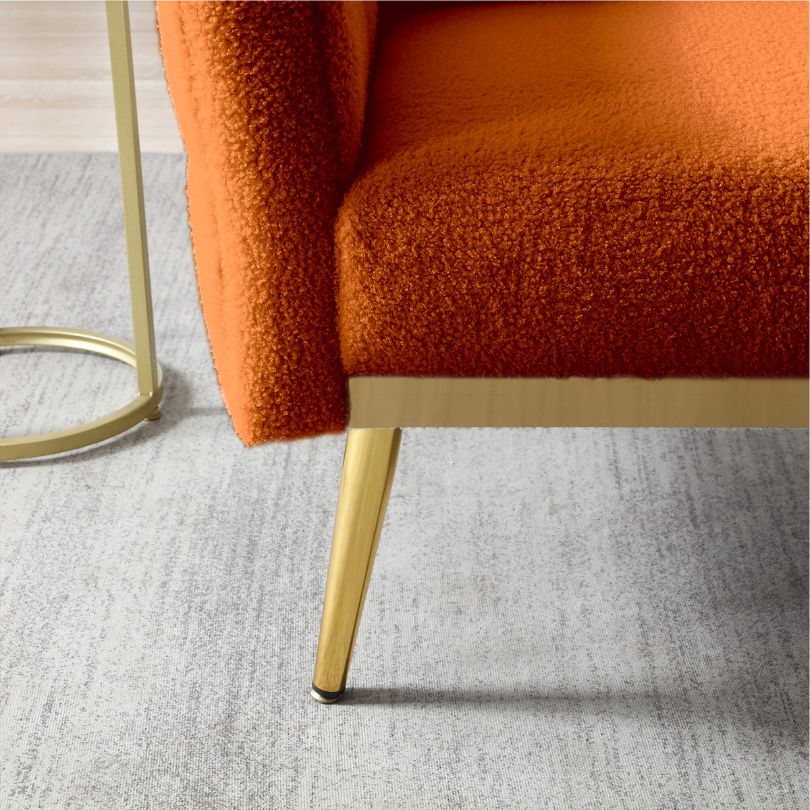 Close-up view of the plush teddy fabric and comfort pillow of the accent chair.