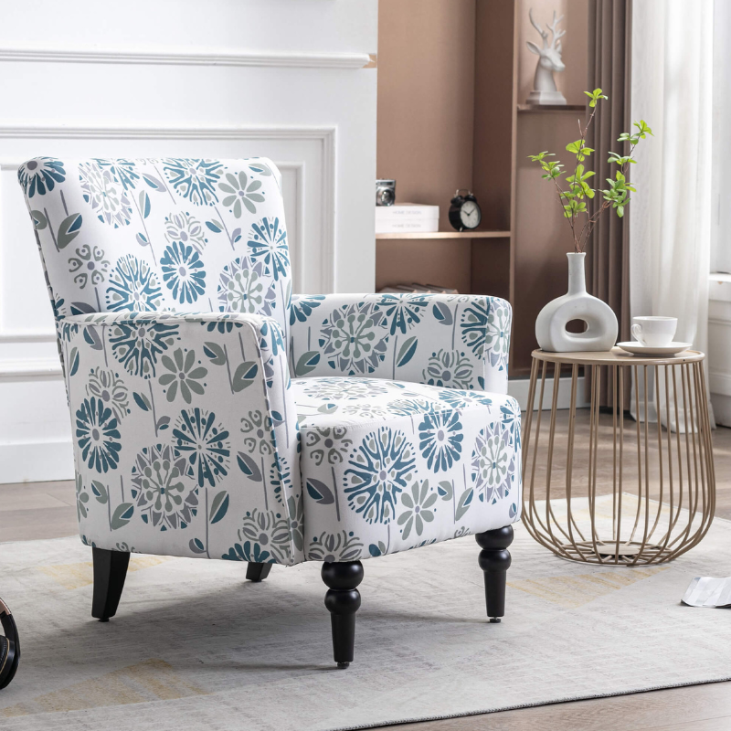 Close-up of the plush linen fabric on the vintage floral armchair, showcasing its quality.