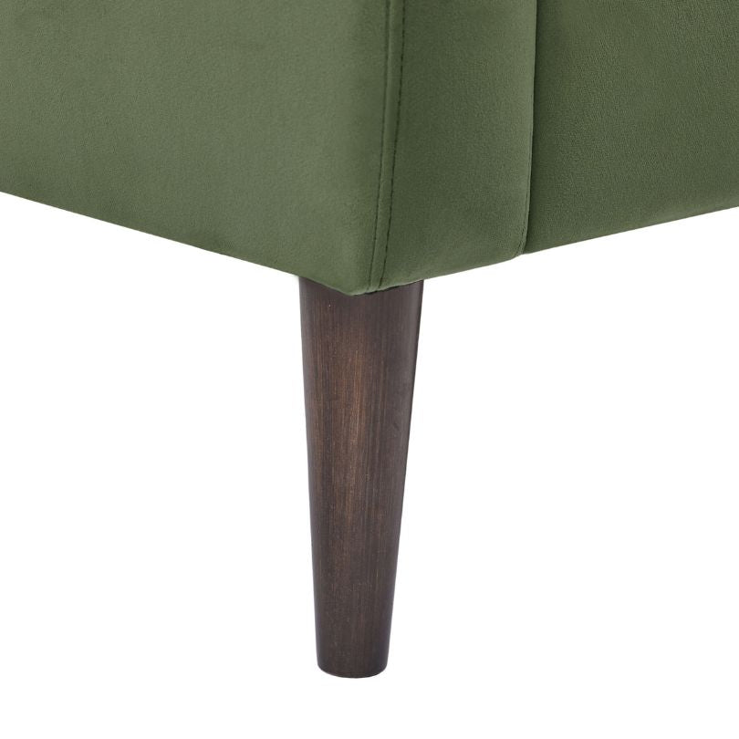 Close-up of the stylish tufted design and velvet material of the accent chair.