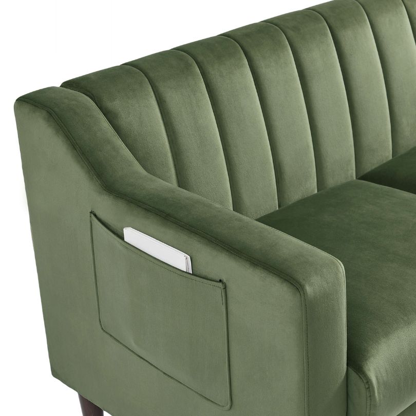 Elegant green tufted barrel accent chair in a cozy living room setting.