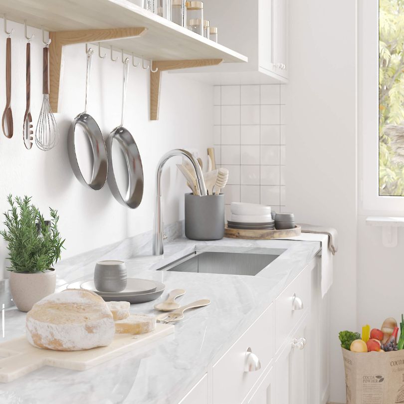 Close-up of the durable stainless steel finish on the undermount kitchen sink.