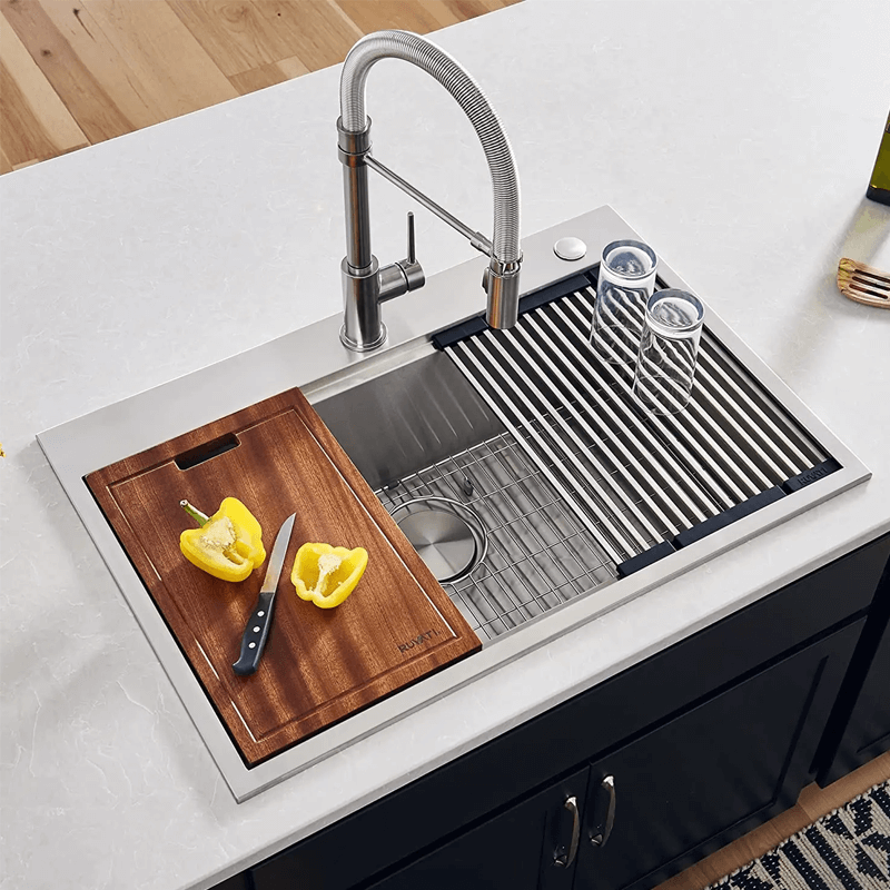 Side view of the modern double bowl kitchen sink showing rounded corners and ledge design.