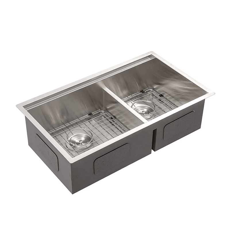 Side view of the modern double bowl kitchen sink showing rounded corners and ledge design.