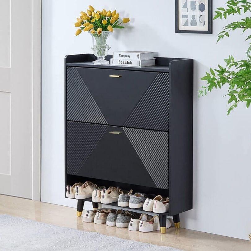 Front view of Modulo 33 black shoe organizer with flip drawers in a modern entryway