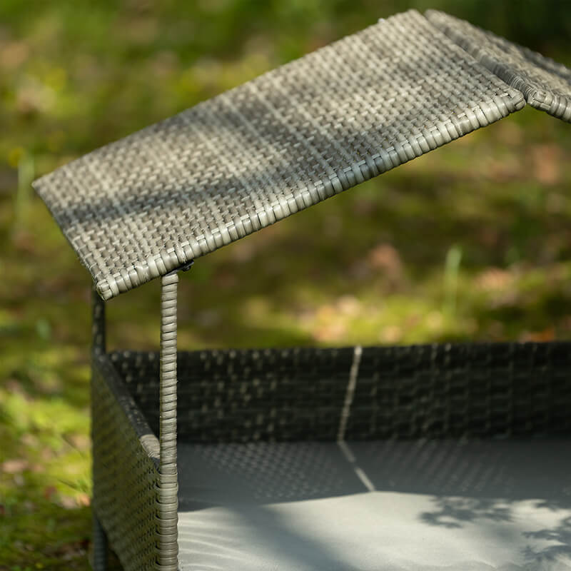 Side angle of the elevated dog house highlighting the protective canopy.