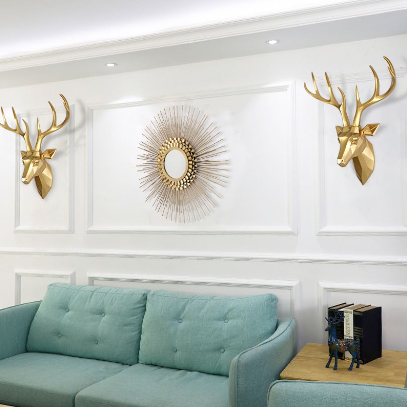 Side angle of the deer wall sculpture highlighting the lifelike antlers.