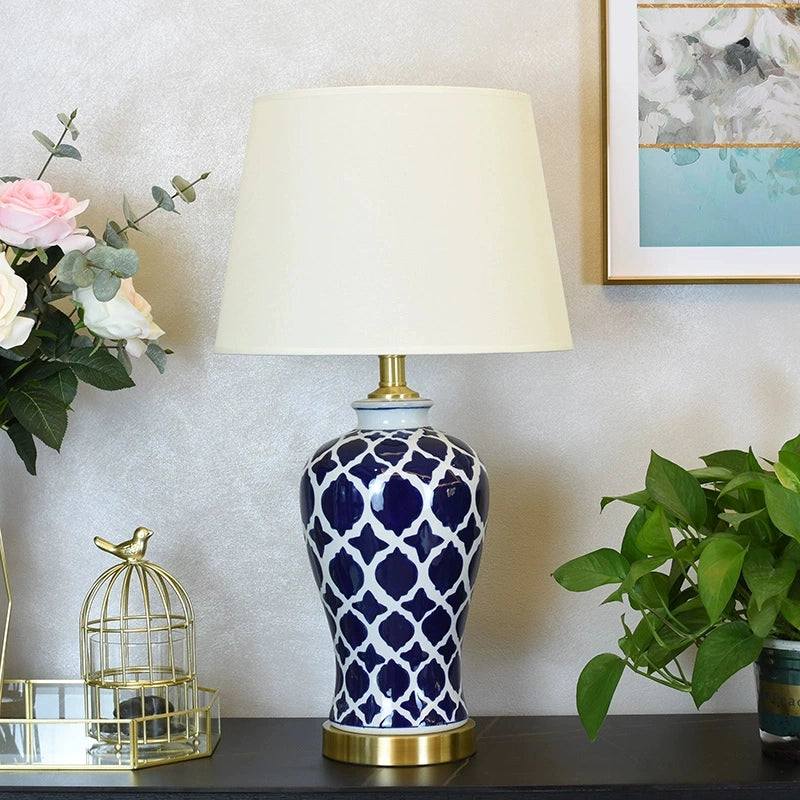Close-up of fabric shade paired with the ceramic base with knob switch