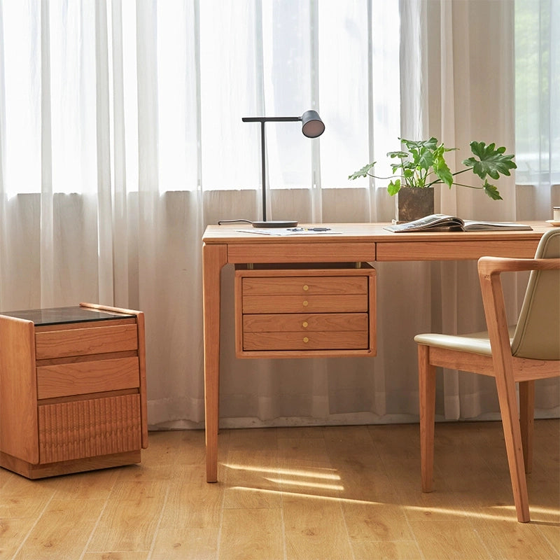 Close-up of the storage drawers on the cherry wood desk, highlighting functionality.