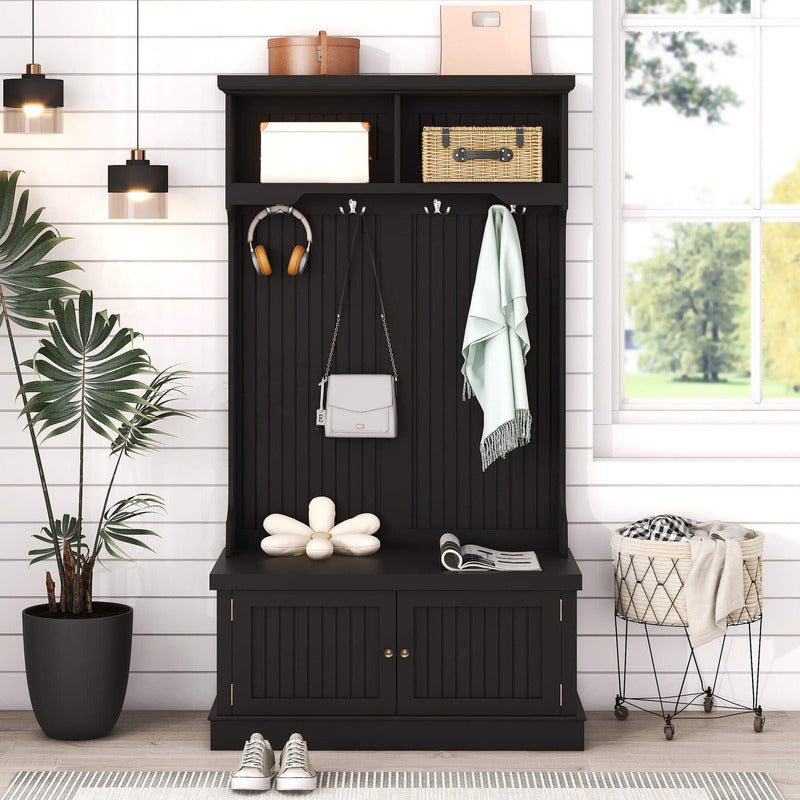 Side view of the modern black entryway storage cabinet with coat hooks, display shelf, and bench for a stylish, functional mudroom.
