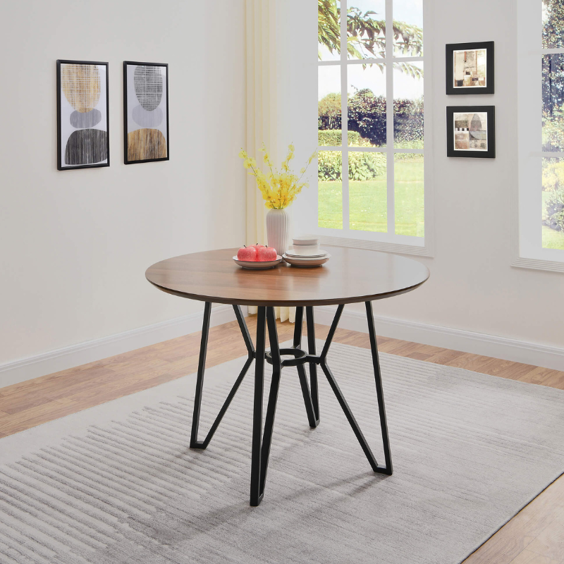 Close-up of the round walnut table showcasing the rich wood grain and sturdy metal support.