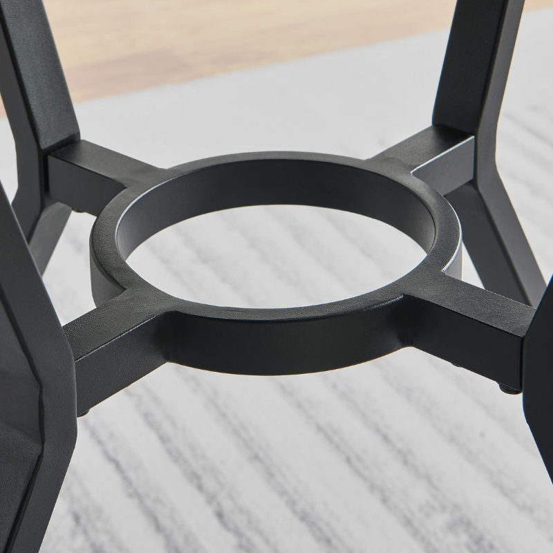 Chic industrial round walnut dining table with a sleek metal base, ideal for modern dining rooms.