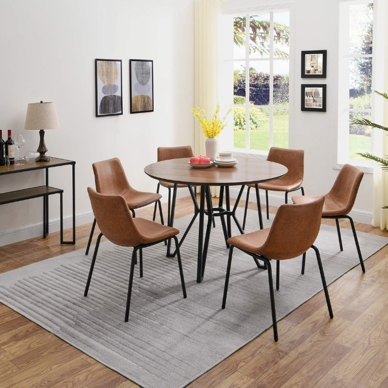 Chic industrial round walnut dining table with a sleek metal base, ideal for modern dining rooms.