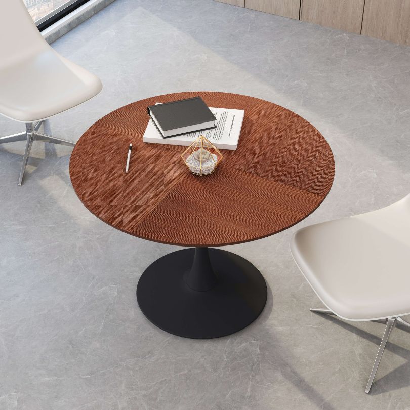 Cozy dining setup featuring the round oak dining table with stylish black pedestal base.