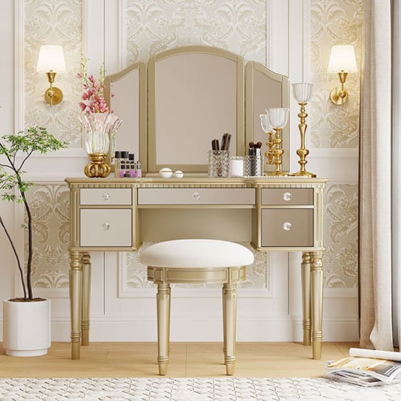 Elegant gold tri-fold mirror dressing table with luxurious design.