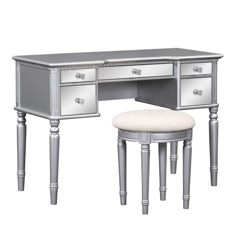 Close-up of mirrored drawers on the tri-fold makeup vanity