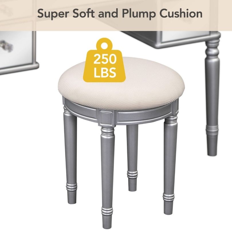 Elegant silver dressing table with tri-fold mirror from a side angle