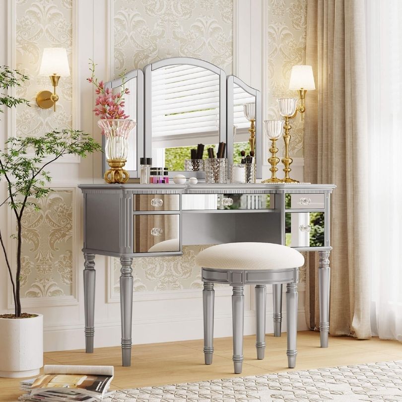 Close-up of mirrored drawers on the tri-fold makeup vanity