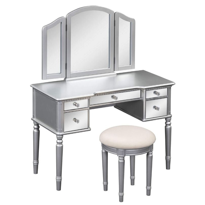 Elegant silver dressing table with tri-fold mirror from a side angle