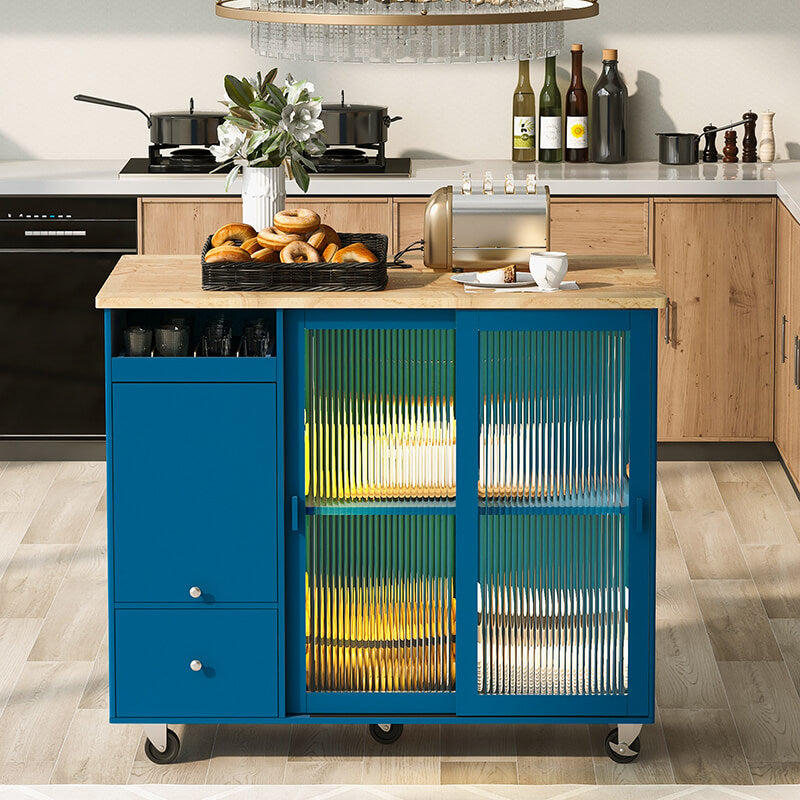 Navy blue kitchen island cart with fluted glass doors from the side view, showcasing its elegant design.