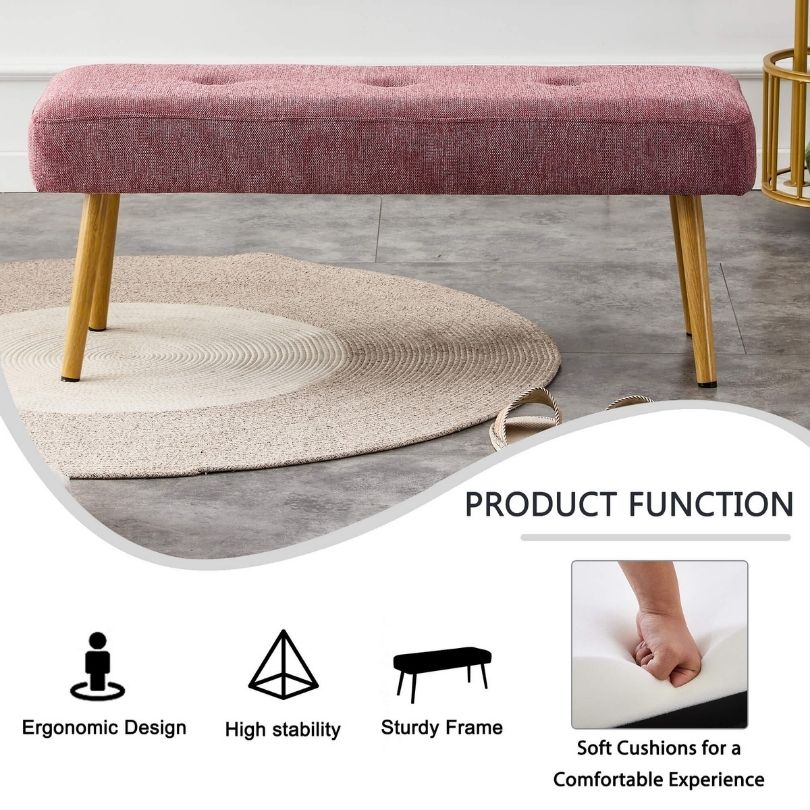Close-up of the pink benchs linen texture and metal leg details, illustrating its quality and style.