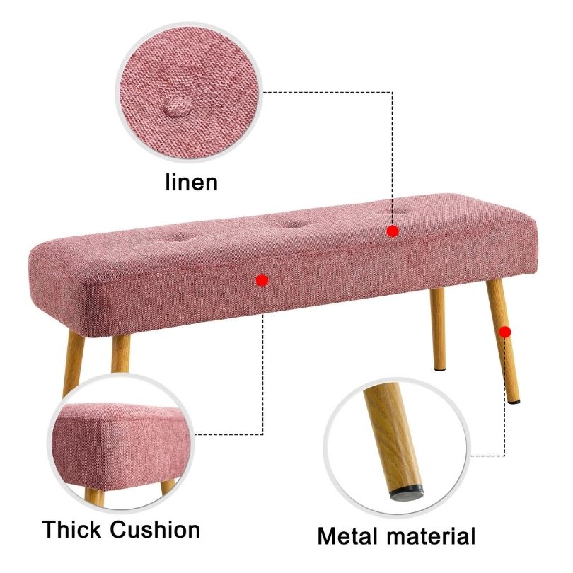 Front view of the pink linen bench in an entryway setting, showcasing its elegant design and metal legs.