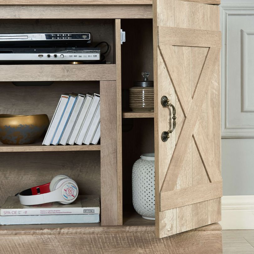 Front view of the gray wooden TV console with open storage space
