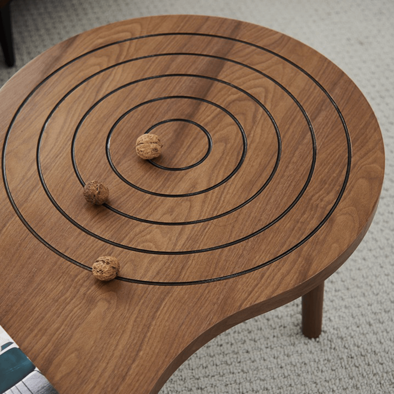 Angle view of Charming 47-Inch Rustic Coffee Table showing the beehive design and glass top.