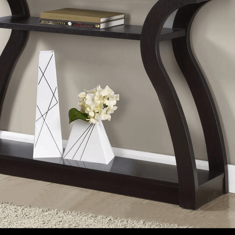 Close-up of dark brown finish and pedestal design highlighting modern furniture elements