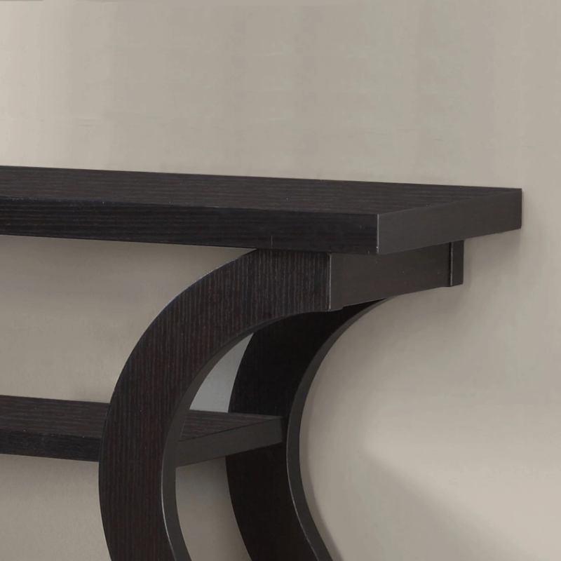 Staged Velora console table against a wall with plants, frames, and books