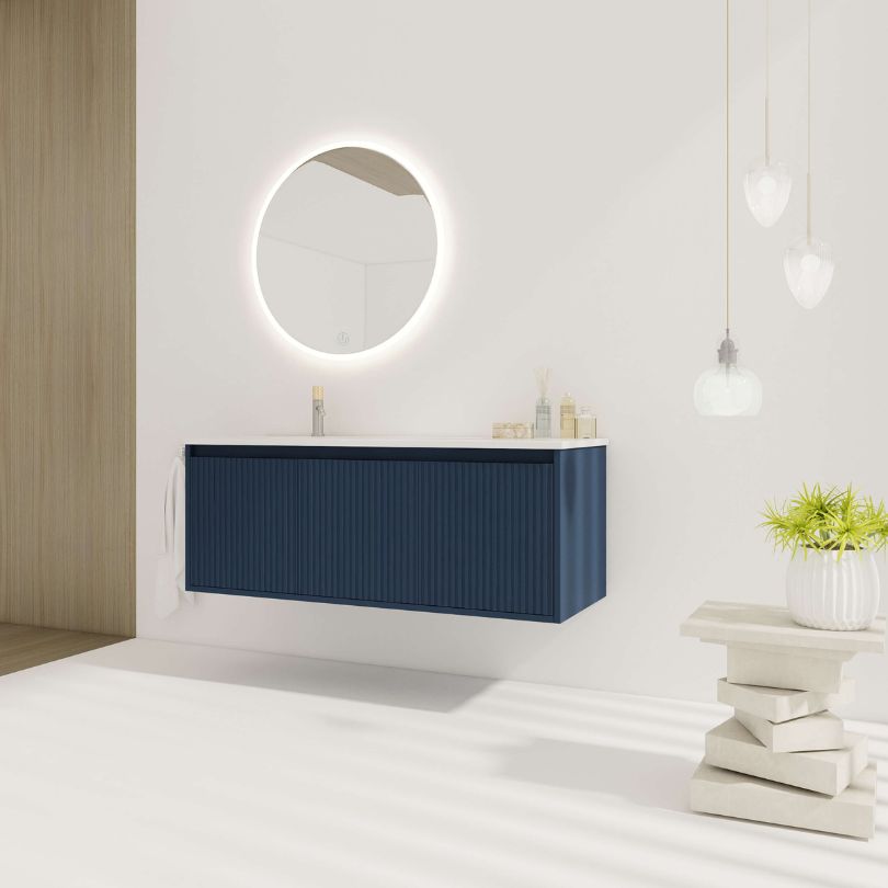 Side view of the navy blue floating bathroom vanity with a resin sink, highlighting its modern design.