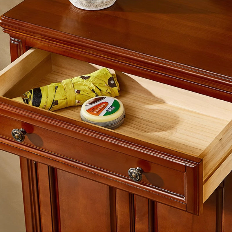 Side view of the vintage wooden shoe cabinet showcasing its sleek design