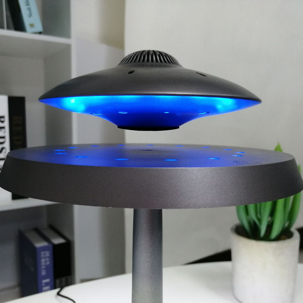 Side view of the UFO 3D smart wireless table lamp showcasing its sleek design and LED light.