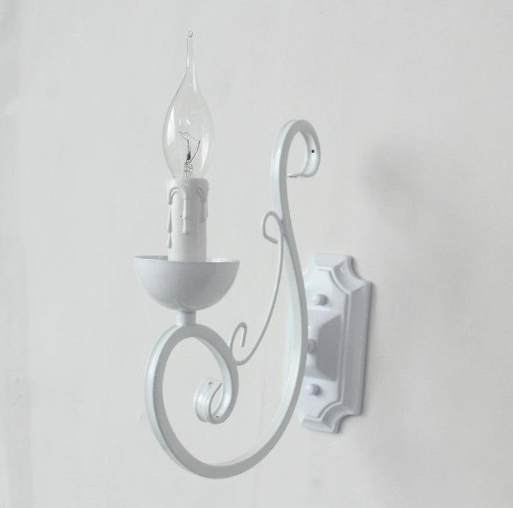 Close-up of the white metal shade of the LED candle wall lamp, showcasing its stylish design.