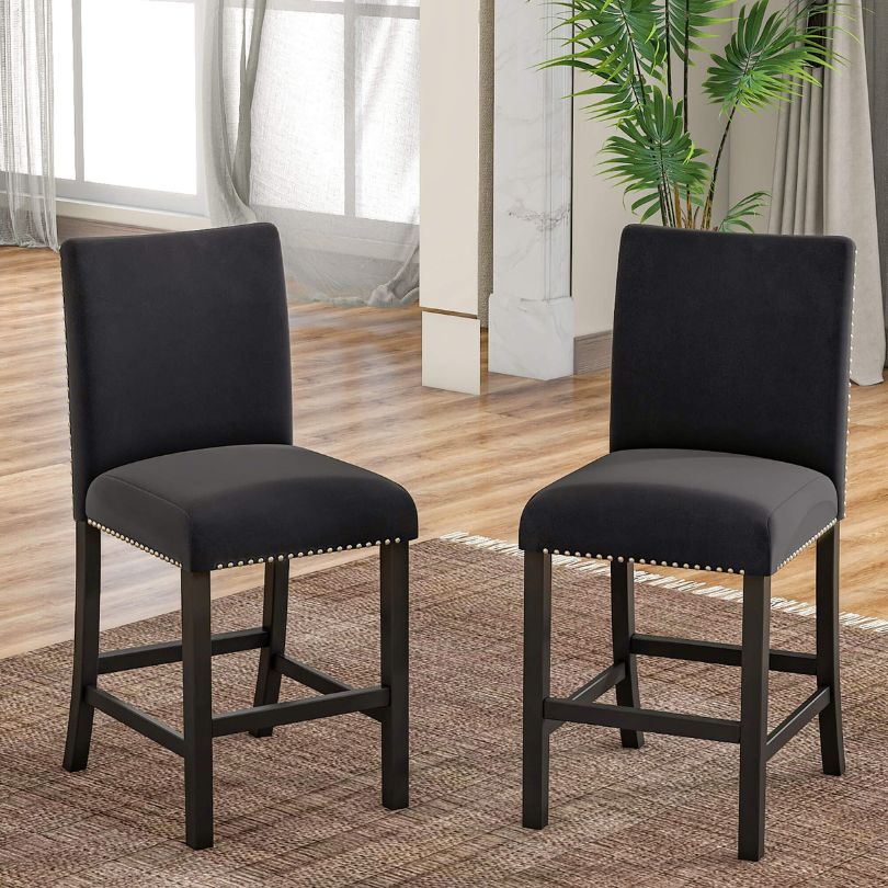 Elegant 5-piece counter height dining set with marble table and black chairs, showcasing a modern dining space.