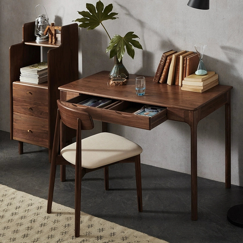 Compact walnut desk in a cozy workspace setting, ideal for writing and creative projects.