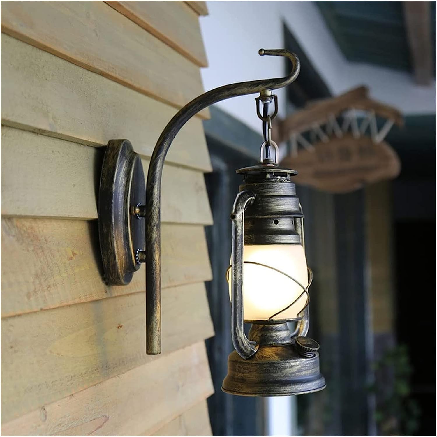 Close-up of the metal and glass design of the barn lantern wall lamp showcasing its elegant features.