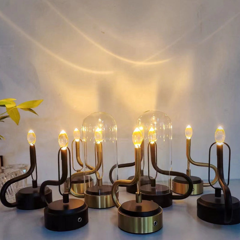 Luminous Flame Rechargeable Glass Table Lamp showcasing candle flame effect in a cozy living room.