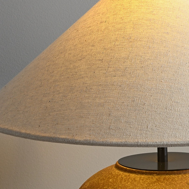 Side angle of the Japanese pottery lamp highlighting the rustic ceramic texture and adjustable switch.