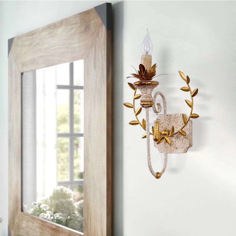 Front view of the elegant brass wall light showcasing its unique design and finish.