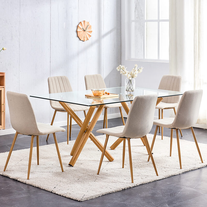 Stylish dining room setup showcasing the modern glass table with natural legs.