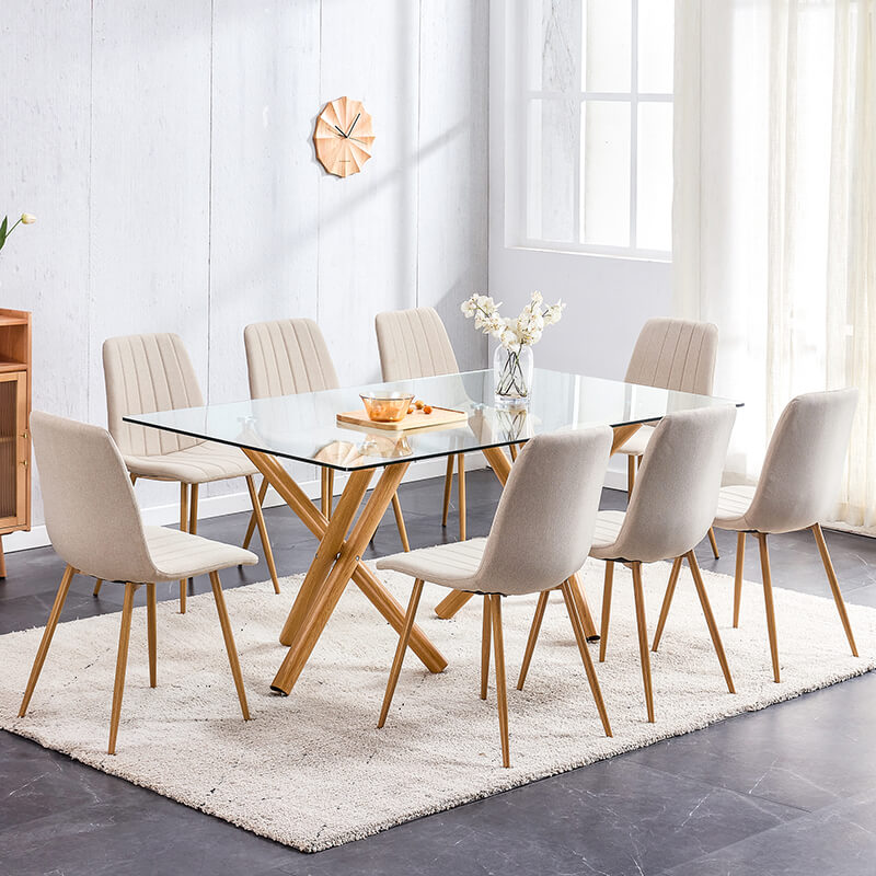 Stylish dining room setup showcasing the modern glass table with natural legs.