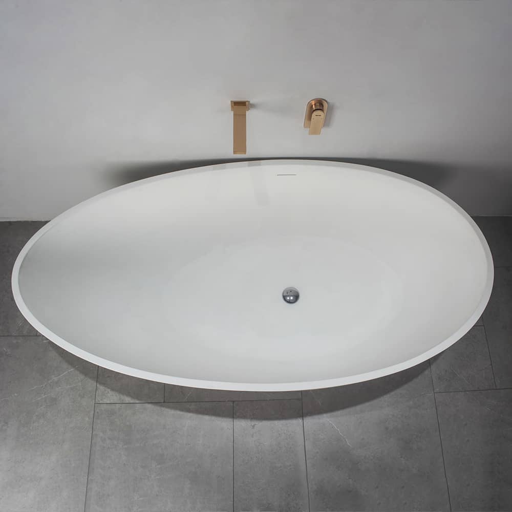 Side view of the freestanding bathtub in a stylish bathroom setting, highlighting its versatility.
